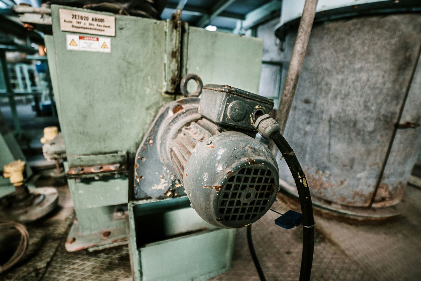 Three-phase electric motor mounted on process equipment