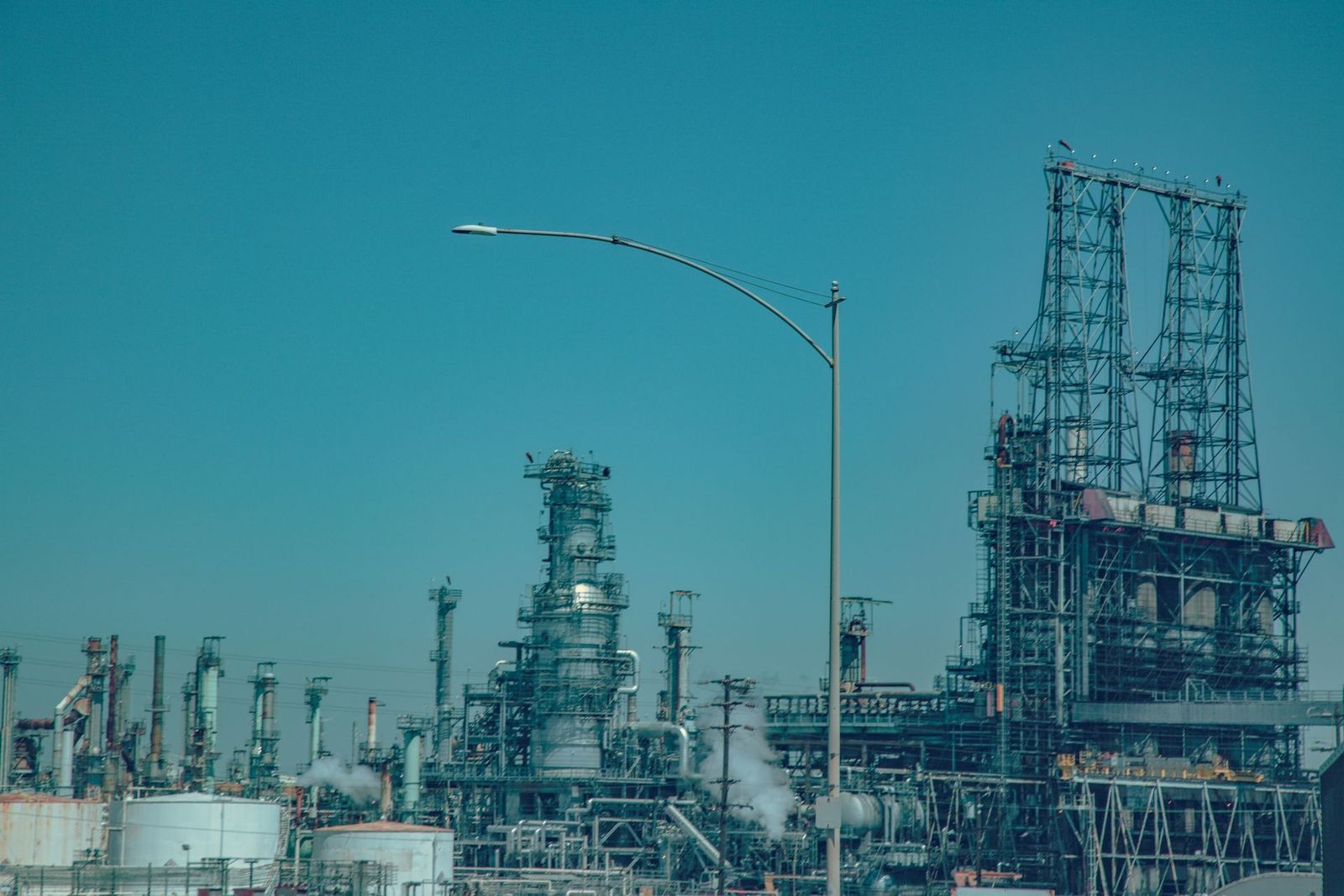 Oil and gas processing facility under a clear sky